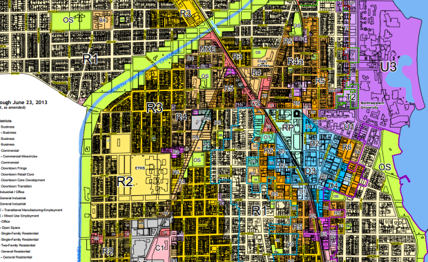Evanston's zoning map illustrates the issue: everywhere except for the blue Downtown zones in the center - and the darkest R5 and R6 zones around it - multi-family development is either illegal or requires extremely impractical minimum lot sizes.