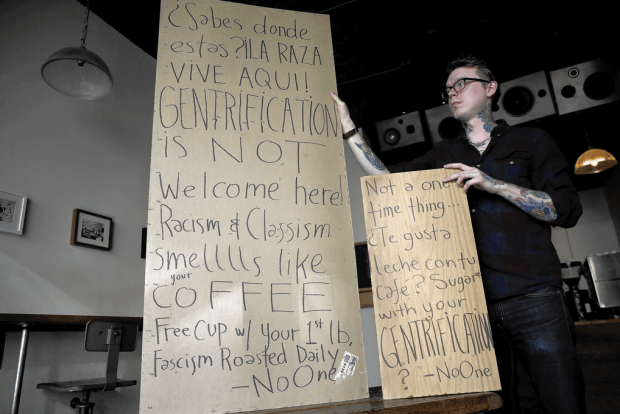 Anti-gentrifiers can make posters. Chicago Tribune.